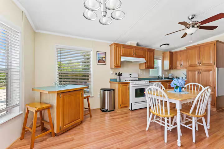 Kitchen and dining area inside the 3 bedroom cottage at Glamp Newport near Newport Rhode Island Kitchen and dining area inside the 3 bedroom cottage rental at Glamp Newport in Portsmouth Rhode Island